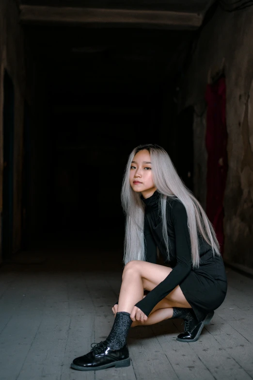 a woman with long white hair sitting on the ground, inspired by Wang E, pexels contest winner, half asian, portrait full body, gray skin. grunge, straight hairstyle