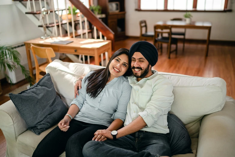 a man and a woman sitting on a couch, a portrait, inspired by Manjit Bawa, pexels contest winner, hurufiyya, smiling couple, avatar image, australian, commercially ready