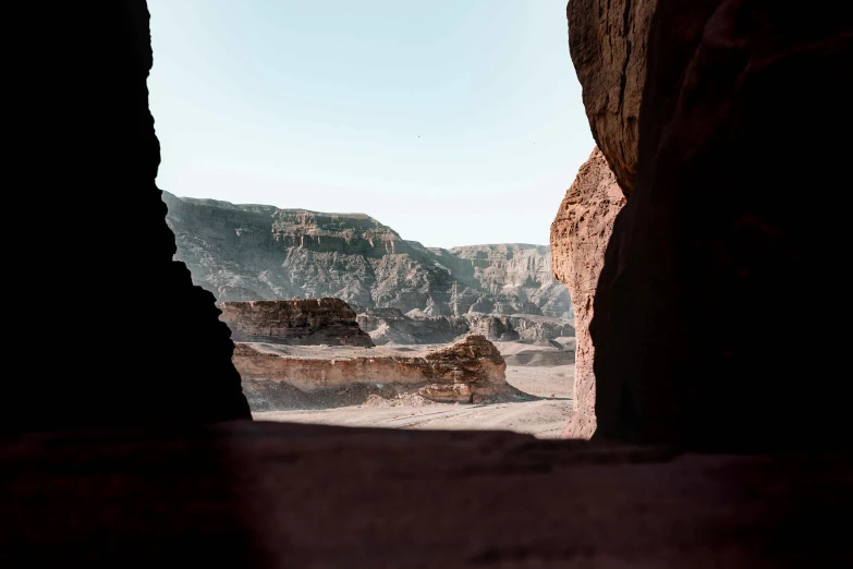 a view of the desert from inside a cave, pexels contest winner, les nabis, egyptian sumerian features, a still of an ethereal, festivals, brown