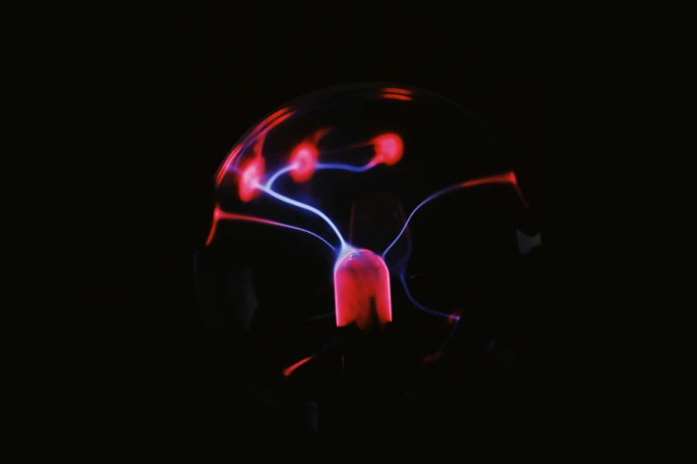 a close up of a light bulb in the dark, a hologram, by Adam Marczyński, pexels, nuclear art, red liquid, neuron, long exposure photo, miniature product photo