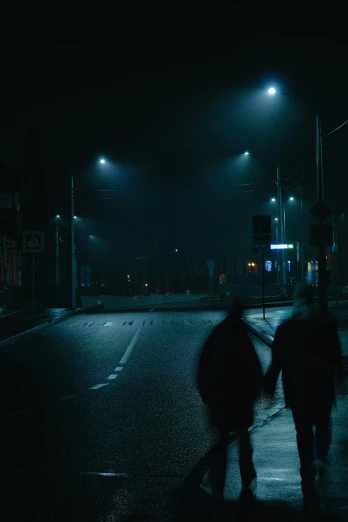 two people walking down a street at night, pexels contest winner, conceptual art, late morning, cinematic lut, ominous background, cold blue light