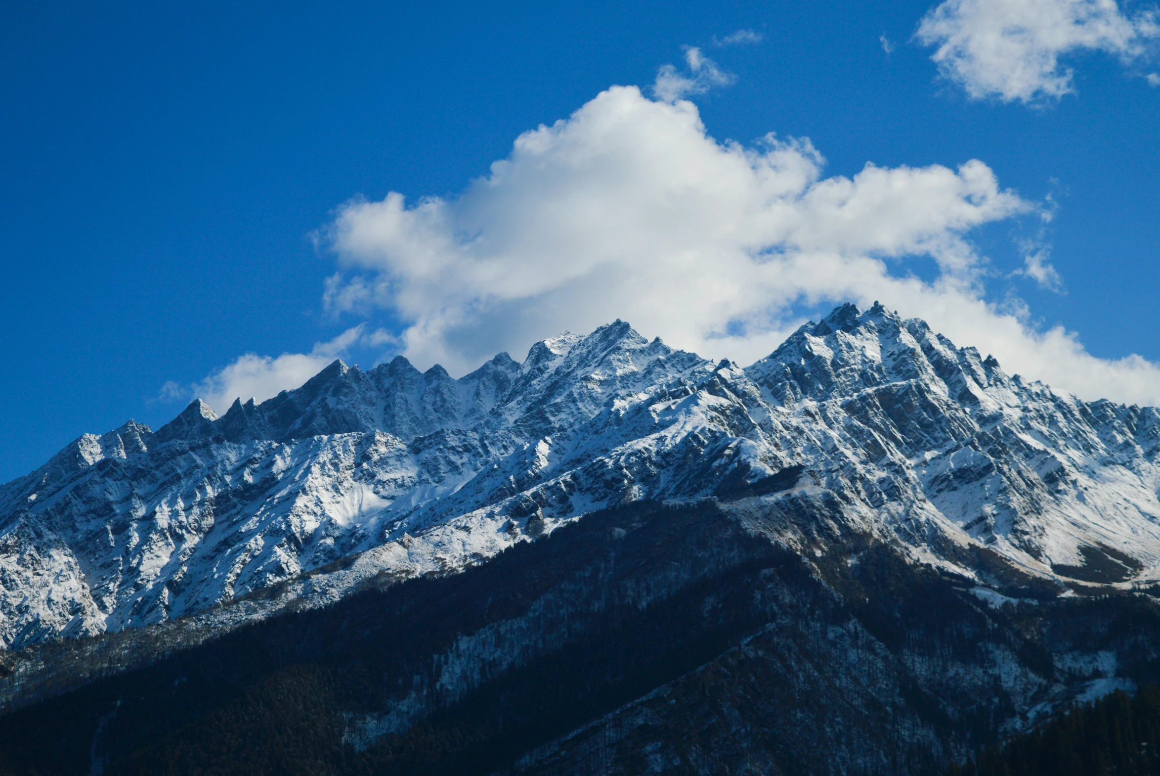 a mountain covered in snow under a blue sky, pexels contest winner, larapi, thumbnail, uttarakhand, multiple stories