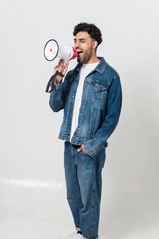 a man with a megaphone in his hand, pexels contest winner, wearing denim, clear background, ashteroth, no - text no - logo