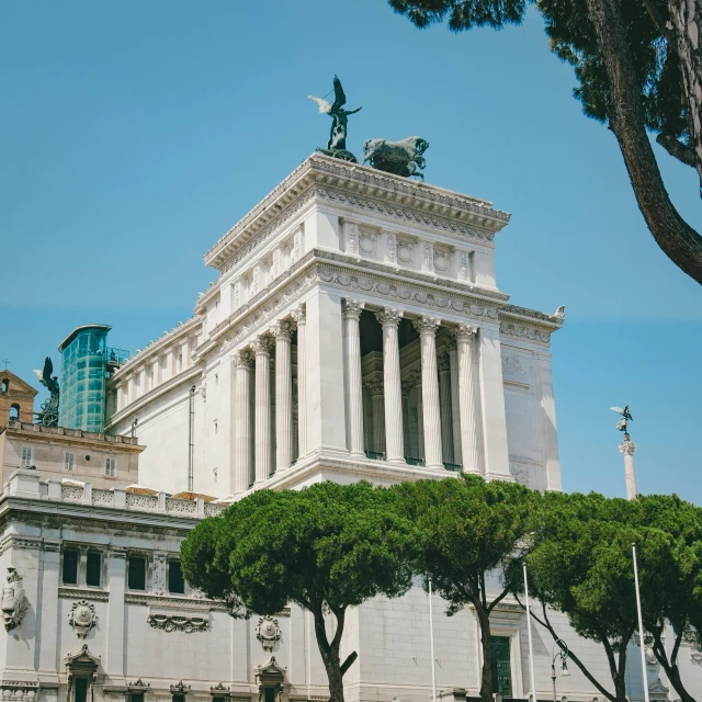 a large white building with trees in front of it, a marble sculpture, inspired by Vincenzo Cabianca, pexels contest winner, roman nose, view from bottom to top, square, tomb