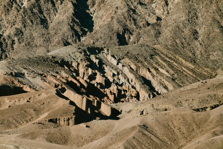 a horse that is standing in the dirt, an album cover, unsplash contest winner, les nabis, shiny layered geological strata, view from helicopter, 1940s photo, mining outpost