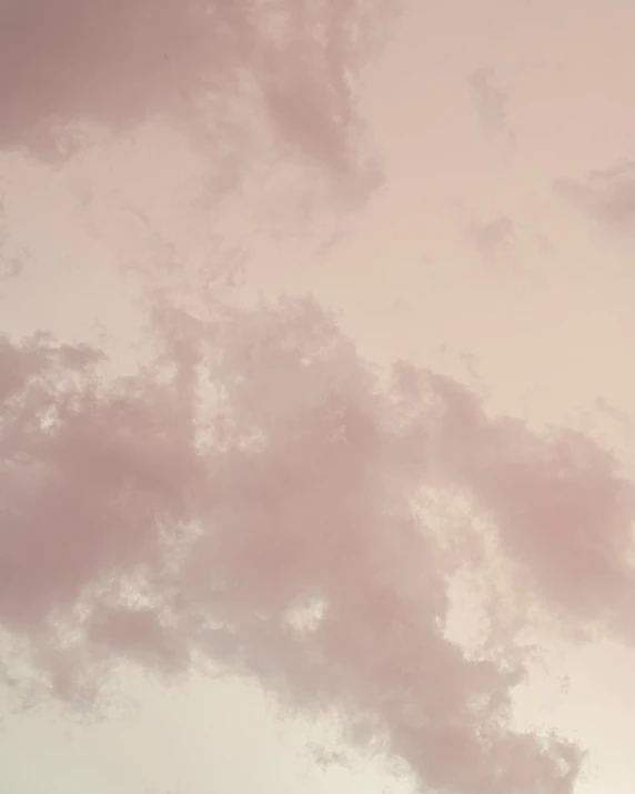 a large jetliner flying through a cloudy sky, an album cover, unsplash, romanticism, pastel pink, ☁🌪🌙👩🏾, the sky is a faint misty red hue, pearlescent hues