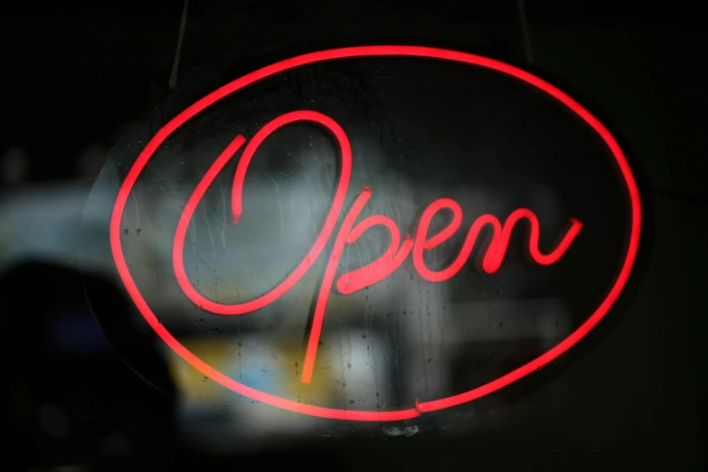 a close up of a neon sign in a window, pexels, happening, open office, convenience store, reuters, open palm