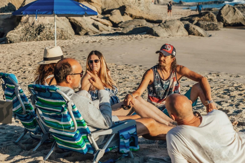 a group of people sitting on top of a sandy beach, brandi love, al fresco, avatar image, customers