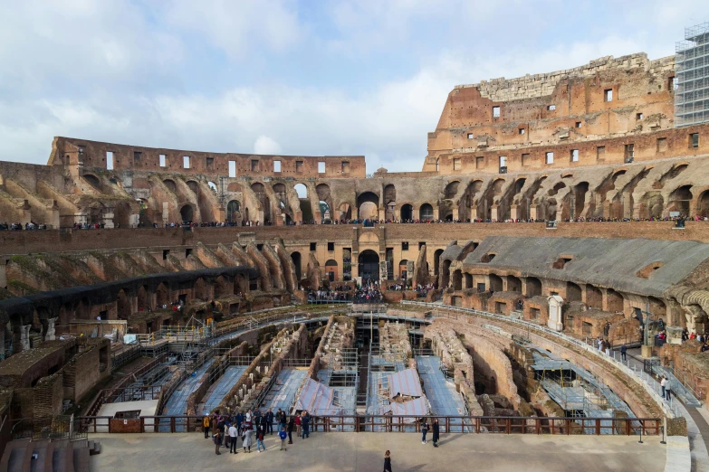 the interior of the colossion in rome, pexels contest winner, standing in an arena, circular towers, brown, black