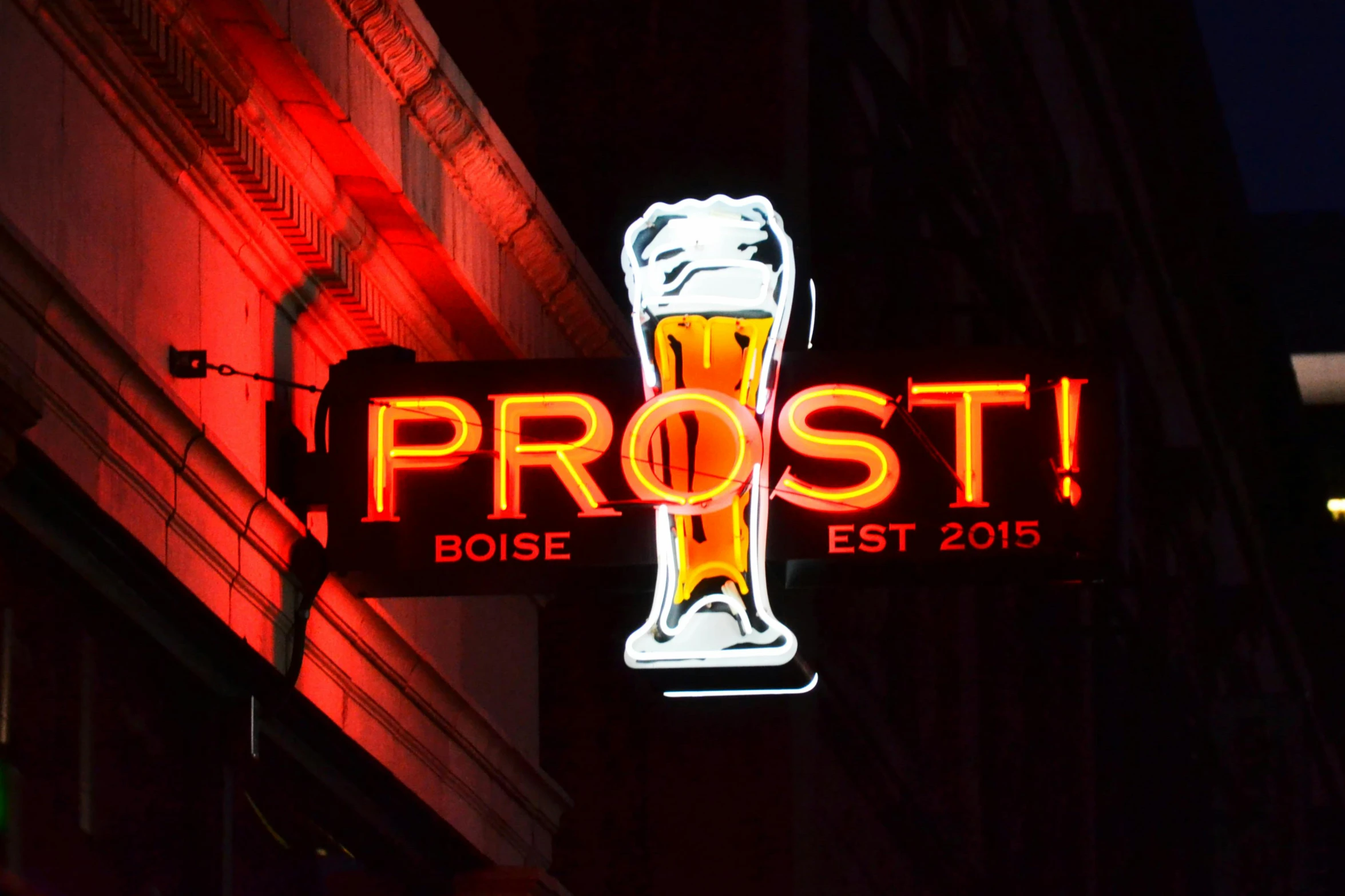 a neon sign on the side of a building, post-impressionism, beer logo, frost, proud smirk, proto-metal