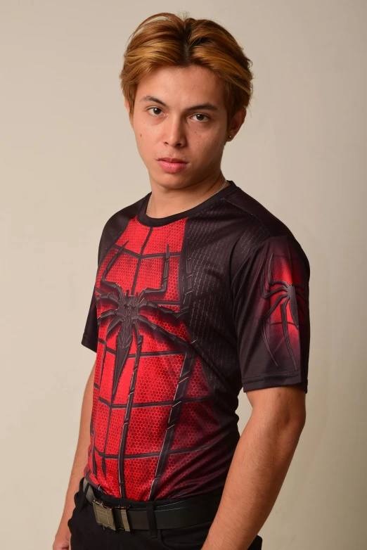 a man in a spider - man t - shirt poses for a picture, a picture, by Eddie Mendoza, shin hanga, cybertech wear, red - black, half body photo, sport t-shirt