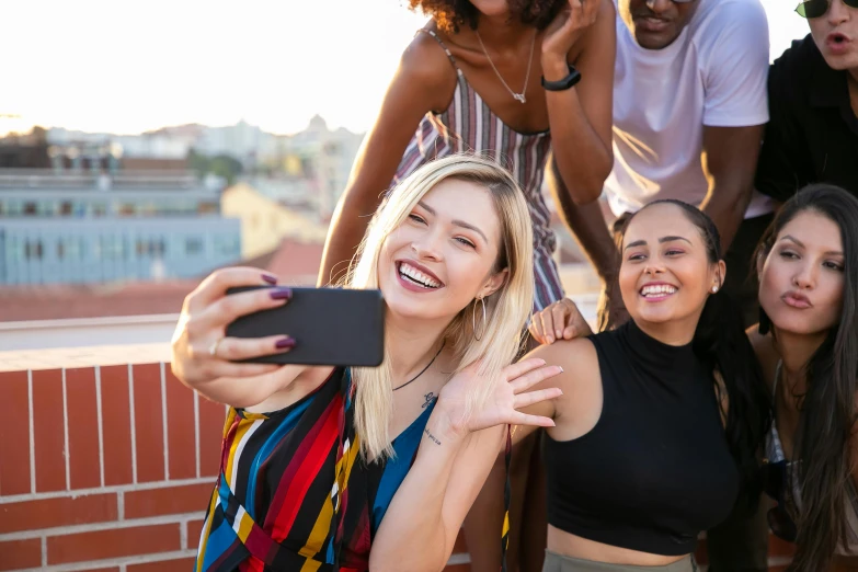 a group of friends taking a selfie together, trending on pexels, girl sitting on a rooftop, essence, a blond, headshot