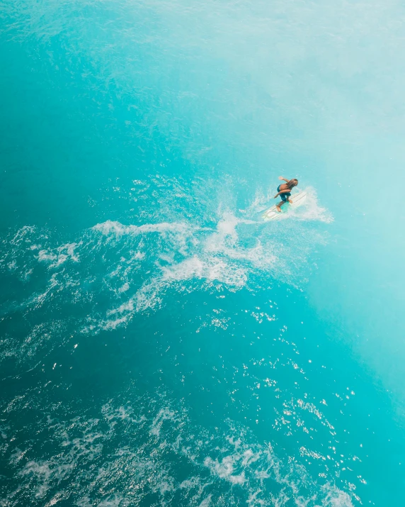 a man riding a wave on top of a surfboard, pexels contest winner, air shot, teal skin, thumbnail, multiple stories