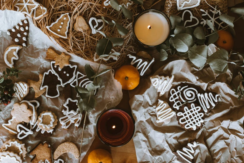 a table topped with lots of cookies and candles, by Daniel Lieske, pexels contest winner, folk art, background image, flat lay, ribbon, seasonal