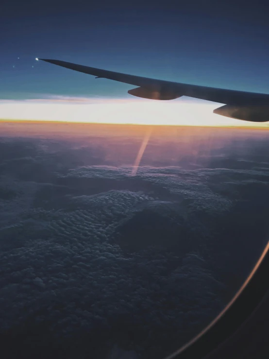 a view of the sky from an airplane window, pexels contest winner, lights in distance, profile picture 1024px, instagram post, waving