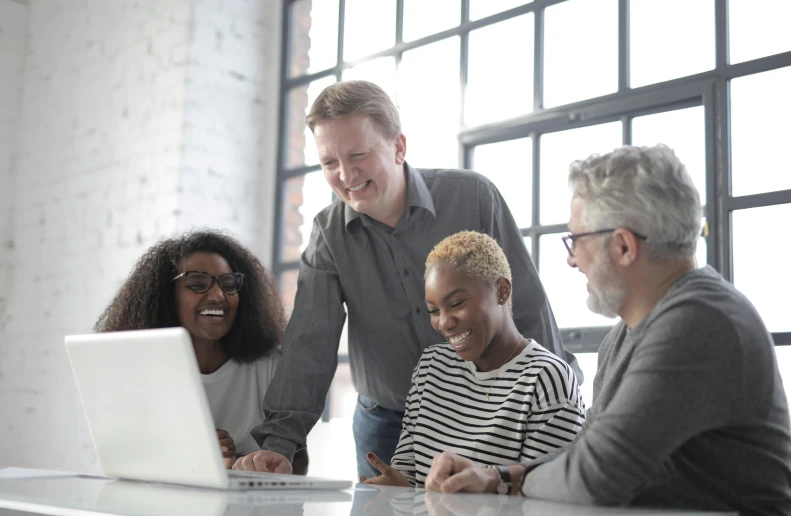 a group of people gathered around a laptop, by Carey Morris, pexels, renaissance, grey, smiling at each other, 15081959 21121991 01012000 4k, stacked image