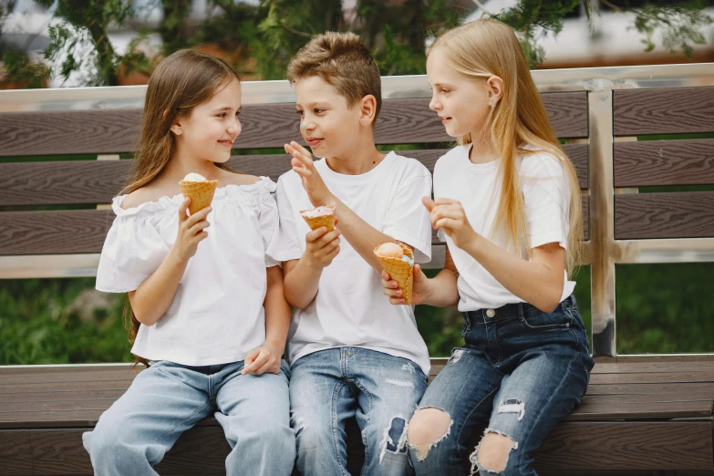 three children sitting on a bench eating ice cream, pexels, white shirt and blue jeans, 15081959 21121991 01012000 4k, promotional image, background image