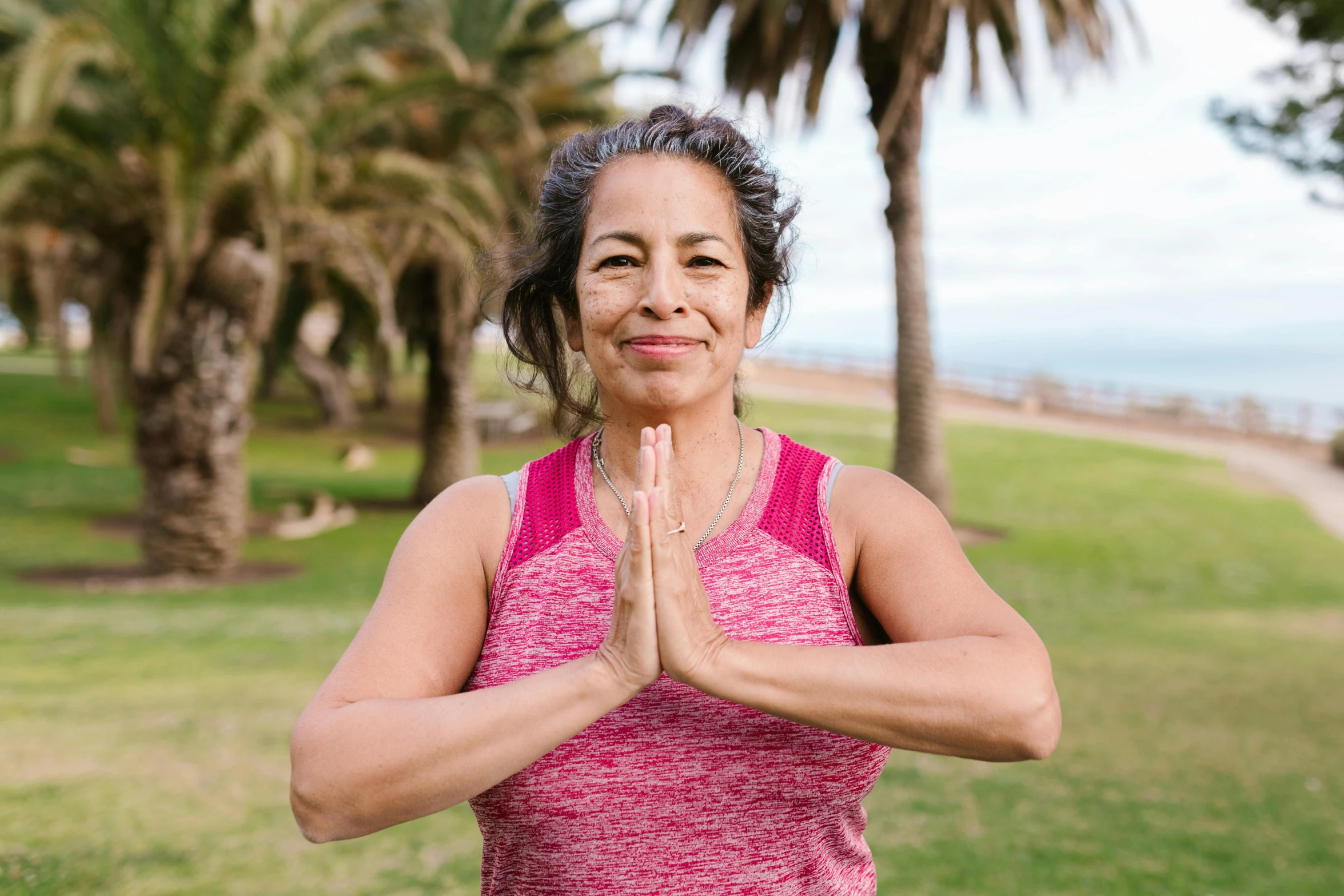 a woman doing yoga outdoors with palm trees in the background, a portrait, pexels contest winner, hurufiyya, avatar image, wrinkles and muscles, hispanic, david nakayama