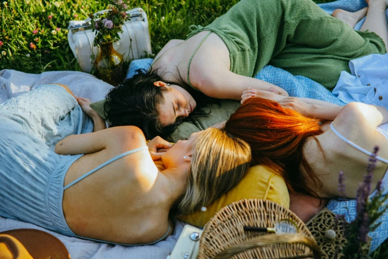 a group of people laying on top of a blanket, by Meredith Dillman, trending on pexels, romanticism, picnic, lesbian embrace, profile image, midsummer