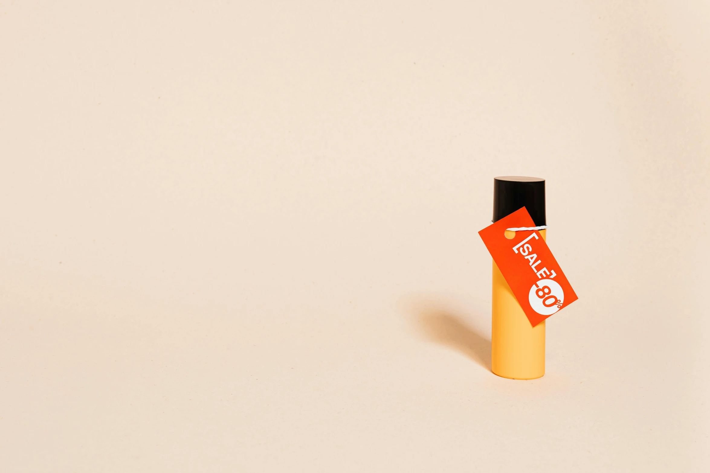 a close up of a bottle of perfume on a white surface, an album cover, unsplash, tachisme, orange backgorund, hanafuda, tag, tanned