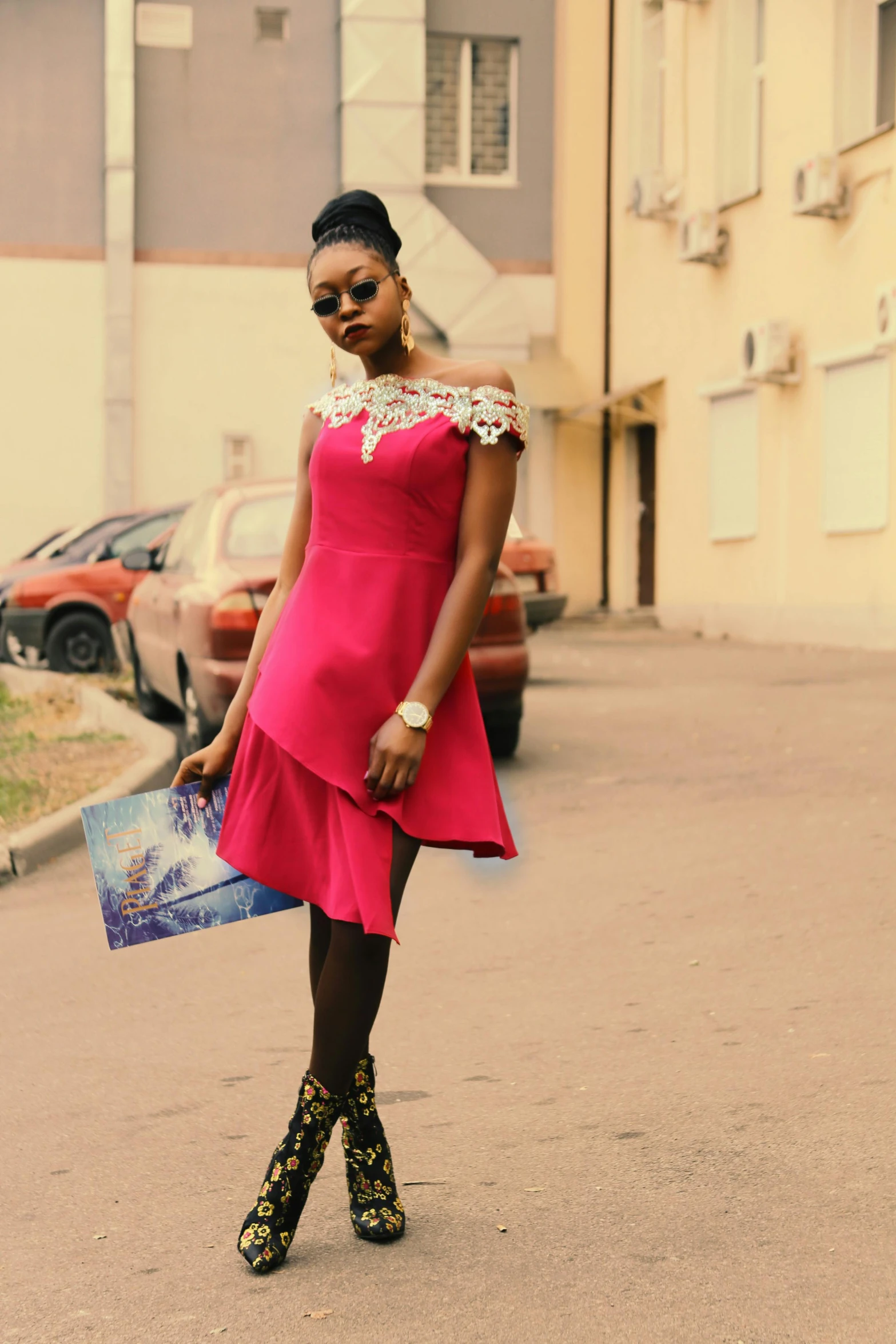 a woman in a pink dress walking down a street, inspired by Chinwe Chukwuogo-Roy, pexels contest winner, frontal pose, crimson themed, épaule devant pose, high details