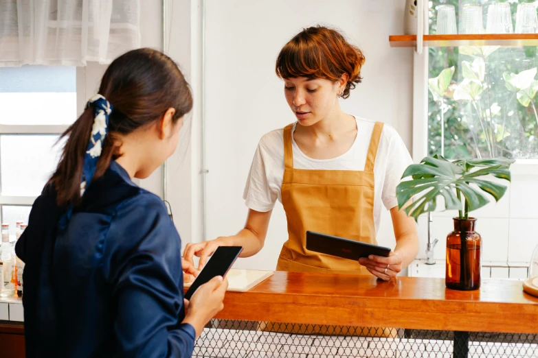 a woman that is standing in front of a counter, trending on pexels, integrating with technology, ( waitress ) girl, fiona staples and kinu nishimura, holding a clipboard