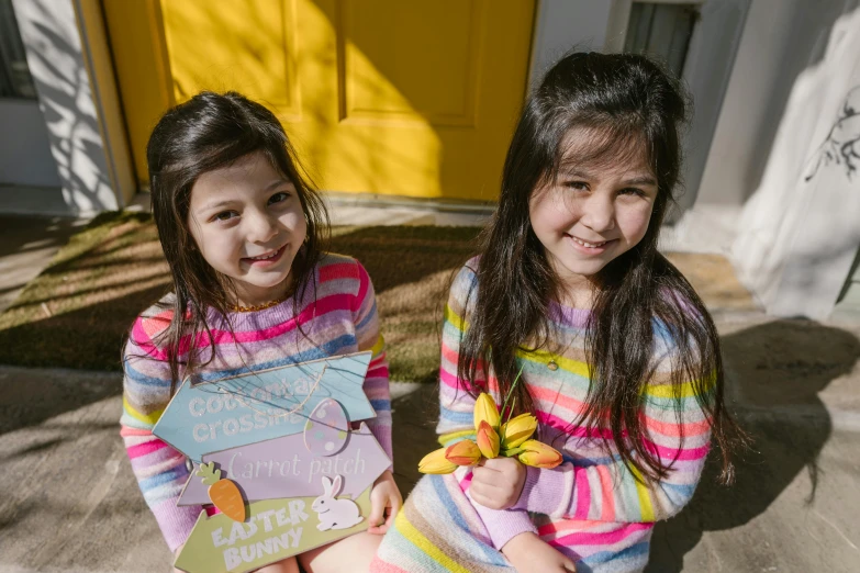 a couple of young girls sitting next to each other, a picture, pexels contest winner, easter, standing outside a house, avatar image, jordan grimmer and natasha tan