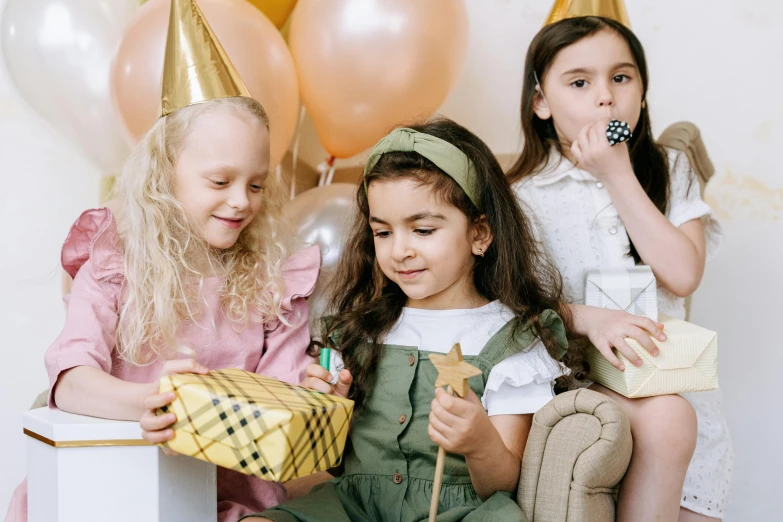 a group of young girls sitting next to each other, by Emma Andijewska, pexels, arts and crafts movement, birthday wrapped presents, background image