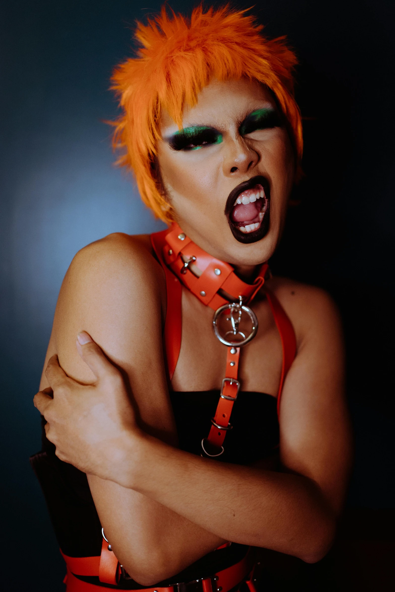 a close up of a person with an orange hair, an album cover, inspired by Tadanori Yokoo, transgressive art, wearing choker, screaming fashion model face, y2k”, photo from a promo shoot