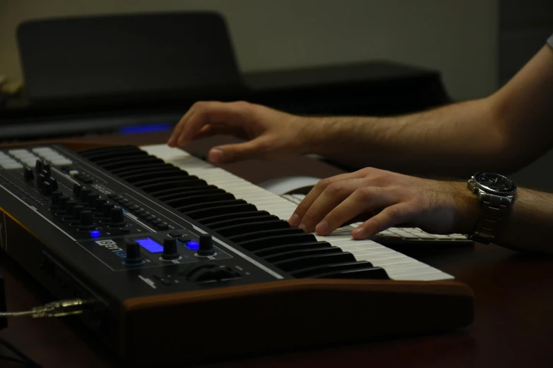 a close up of a person playing a keyboard, by Robbie Trevino, studio setup, background image, michael pangrazio, student