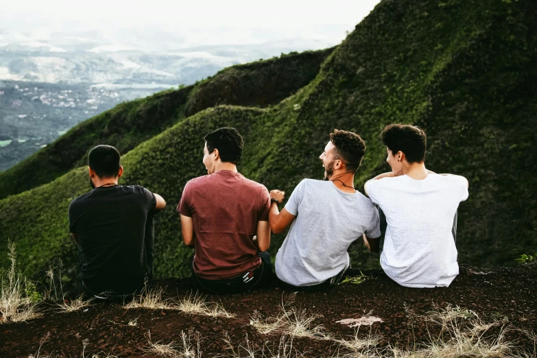 a group of young men sitting on top of a hill, pexels contest winner, te pae, profile image, lush vista, best friends