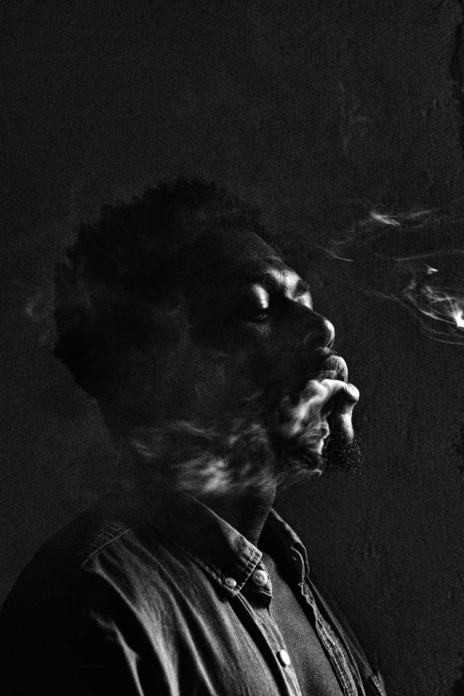 a man smoking a cigarette in a dark room, a black and white photo, inspired by Gordon Parks, : kendrick lamar, 2 1 savage, eyes closed, highly [ detailed ]