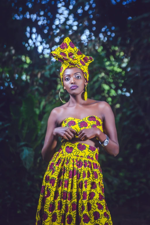 a woman in a yellow and red dress, an album cover, by Ella Guru, pexels contest winner, patterned clothing, wakanda, tube-top dress, traditional clothing