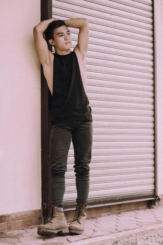 a man leaning against a wall with his hands on his head, inspired by Adam Dario Keel, pexels contest winner, happening, female full body, black tanktop, male ulzzang, pink and black