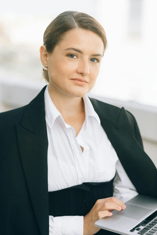 a woman in a business suit holding a laptop, a portrait, by Anna Füssli, trending on reddit, olya bossak, high quality photo, portrait no. 1, madonna genderbend elegant