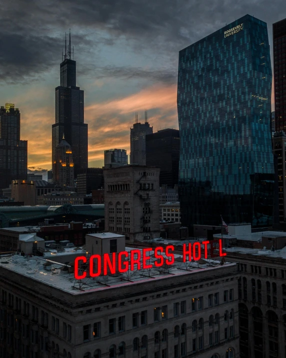 a large neon sign on top of a building, unsplash contest winner, chicago skyline, capitol riot, high contrest, hotel room