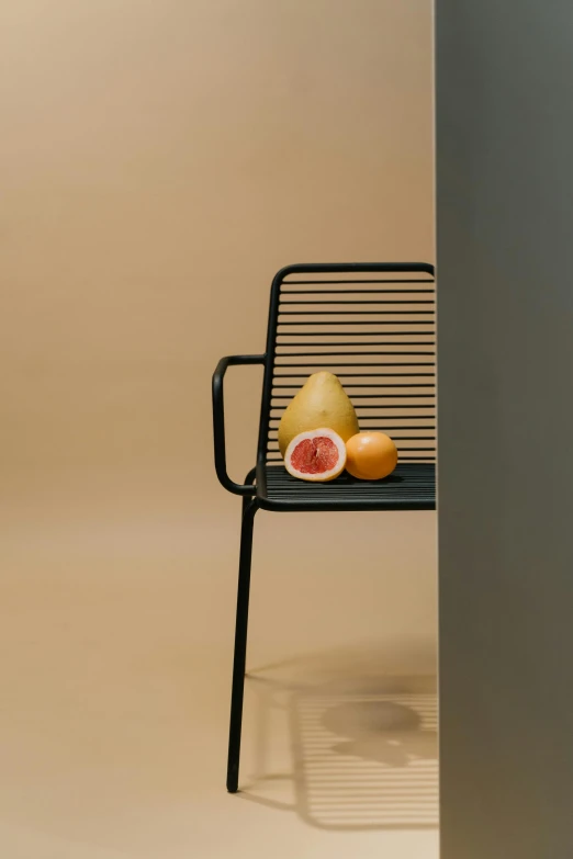 a chair that has some fruit on it, pexels contest winner, side portrait imagery, stylized thin lines, high resolution product photo, aida muluneh