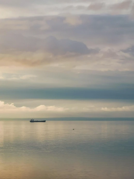 a boat floating on top of a large body of water, a photo, inspired by Elsa Bleda, fan favorite, shipfleet on the horizon, holywood scene, in muted colors