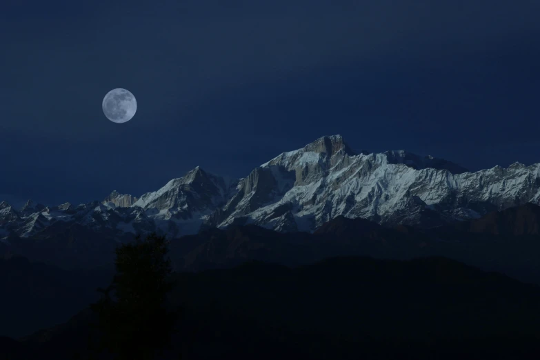 a full moon rising over a mountain range, by Peter Churcher, pexels contest winner, hurufiyya, uttarakhand, profile image, midnight blue