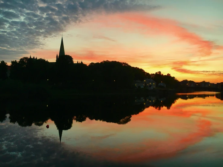 a large body of water with a clock tower in the distance, by Jan Tengnagel, pexels contest winner, hurufiyya, sunset panorama, esher, shot with a gopro, majestic spires