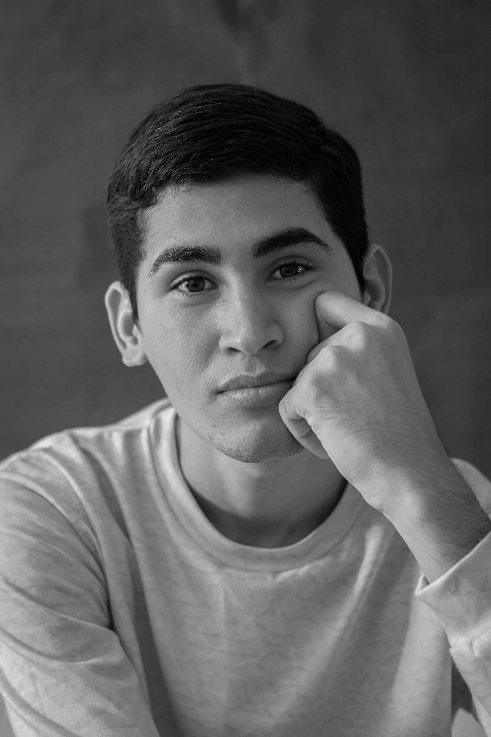 a black and white photo of a young man, a black and white photo, inspired by Ismail Acar, david marquez, taken in the late 2010s, male teenager, uploaded