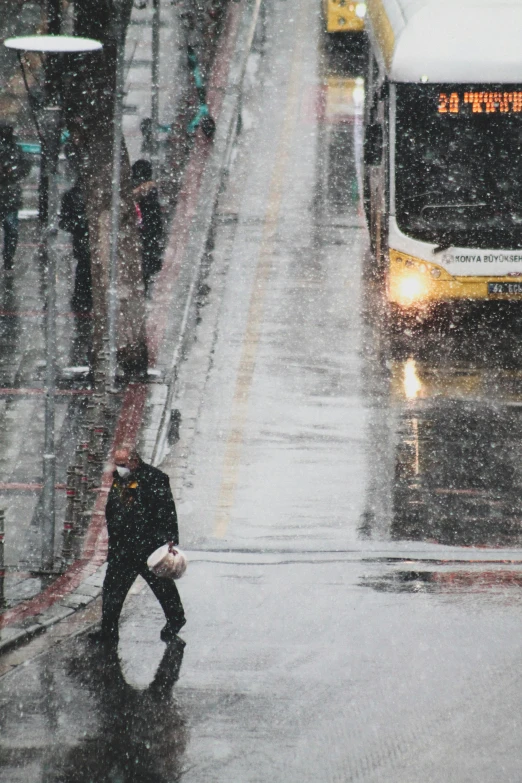 a person crossing a street in the rain, in the snow, seattle completely wasted away, 2019 trending photo, train station explosion