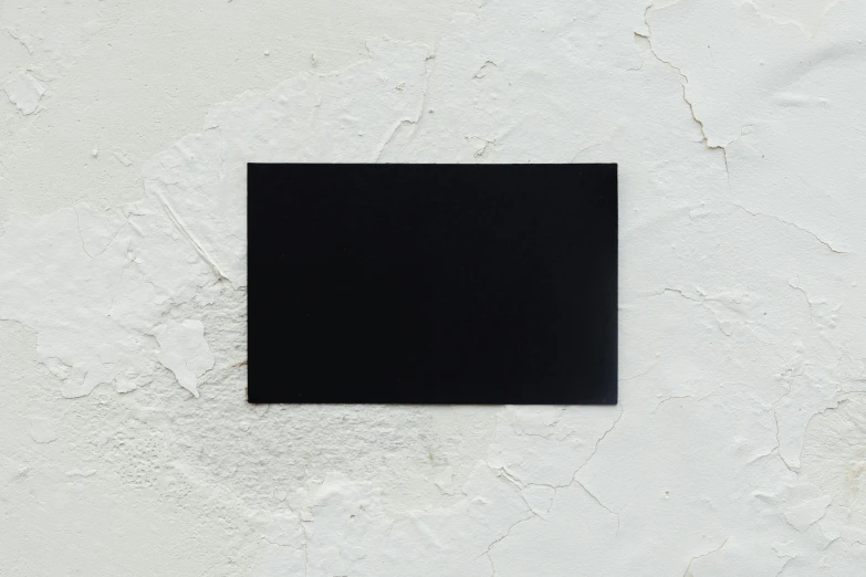 a black square on a white wall, unsplash, whole card, main colour - black, small, slate