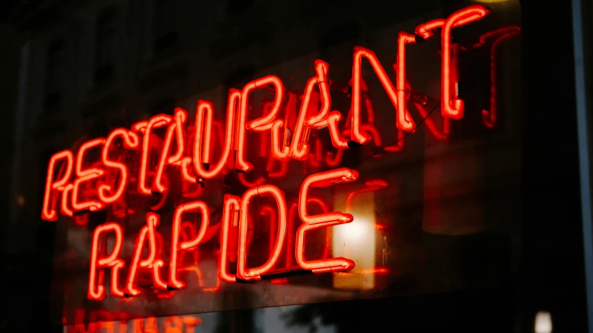 a neon sign in the window of a restaurant, verdadism, carbide lamp, profile image, parade, a radiant