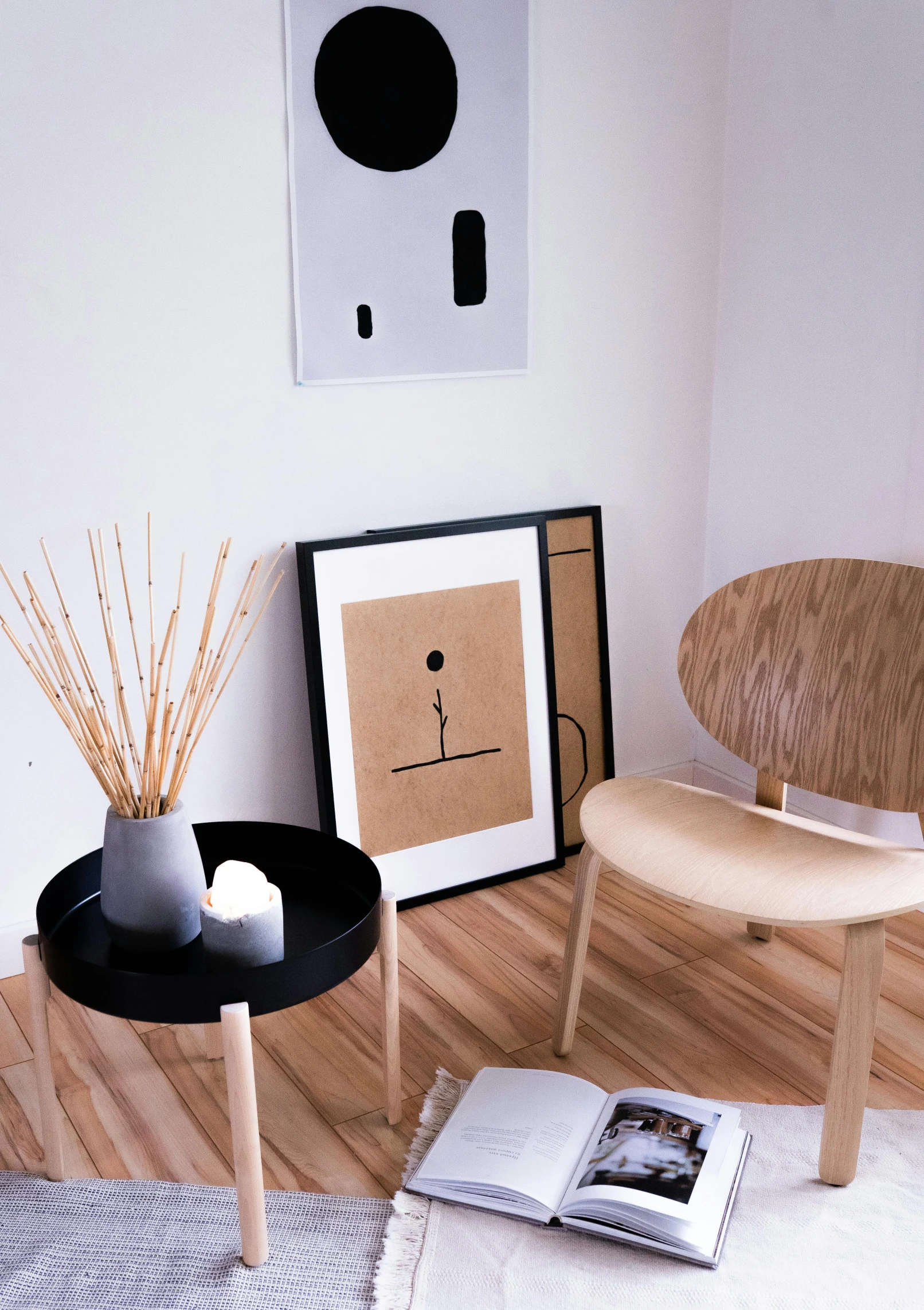 a chair sitting on top of a wooden floor next to a table, poster art, inspired by Reinier Nooms, trending on unsplash, in a living room, detailed product image, circle forms, catalog photo