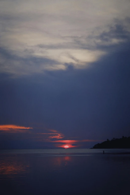 the sun is setting over a body of water, a picture, unsplash, romanticism, medium format. soft light, bali, goodnight, grey