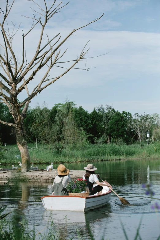 a couple of people in a small boat on a lake, natural botanical gardens, river delta, 2019 trending photo, 3 5 mm photo