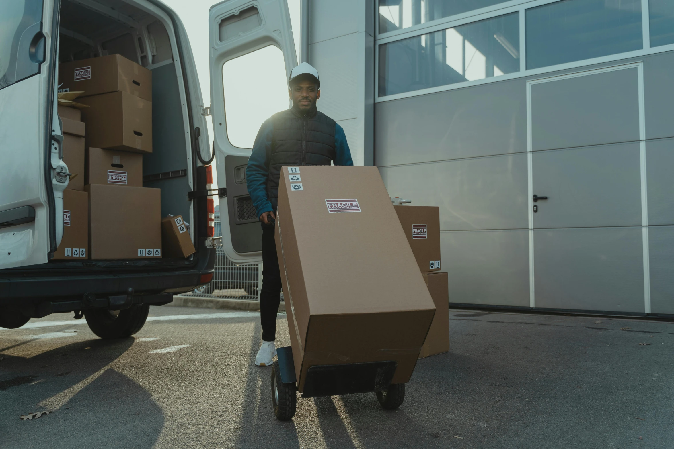 a man pushing a cart full of boxes, pexels contest winner, avatar image, snake van, black man, full body angle