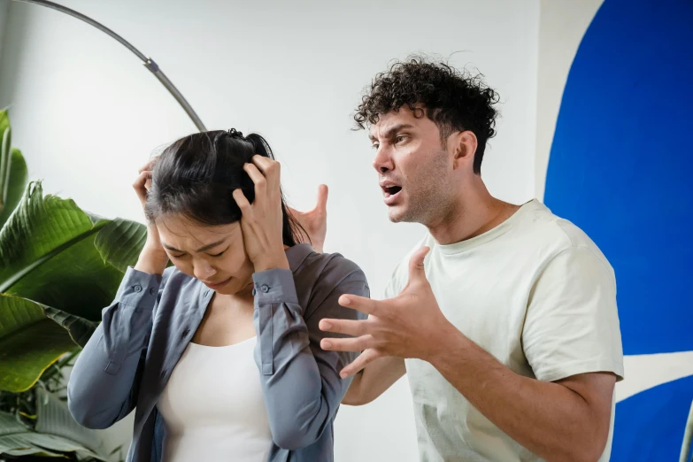 a man and a woman standing next to each other, trending on pexels, renaissance, screaming in pain, asian man, tinnitus, with violence