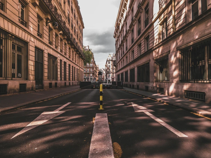 an empty street in the middle of a city, an album cover, by Raphaël Collin, pexels contest winner, fan favorite, musee d'orsay 8 k, hd footage, houses and roads